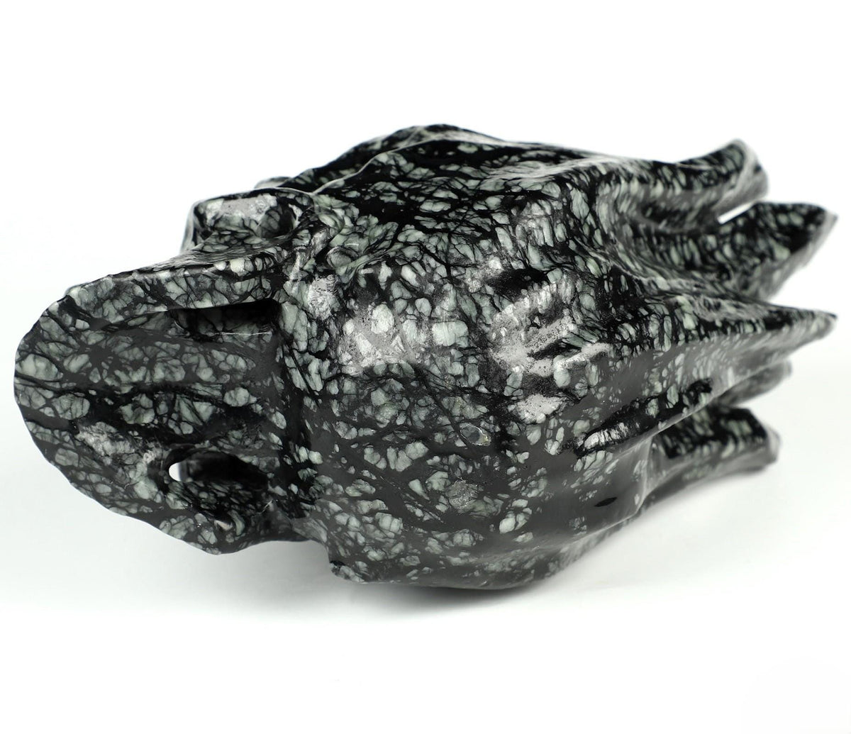 Brandende schedel van Picasso-jasper · Natuurstenen sculptuur, curiosacabinet